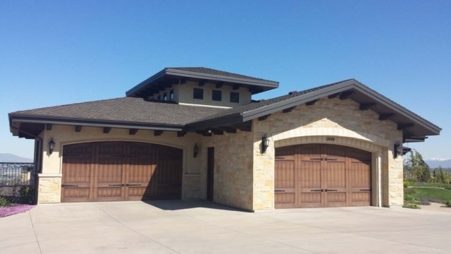 Double garage with carriage house door style and stone accents in San Jose, CA
