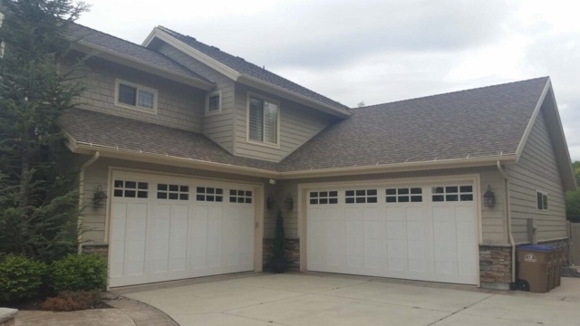 White carriage house door style garage doors on a suburban home in San Jose, CA