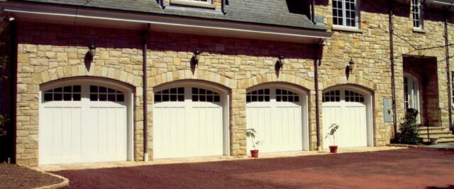 Four White Hormann Garage Doors with Arched Windows Installed on a Luxury Home in San Jose, CA