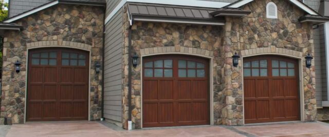 Three Hormann Garage Doors with Arched Windows and Rich Wood-Grain Panels Installed in San Jose, CA